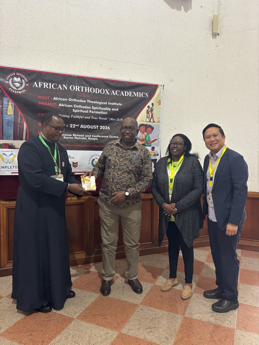 Participants photographed beside the project banner.