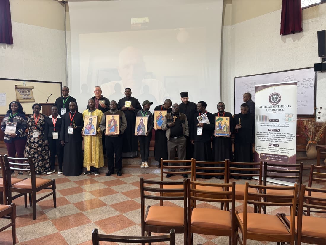 Participants holding icons at the close of the workshop.
