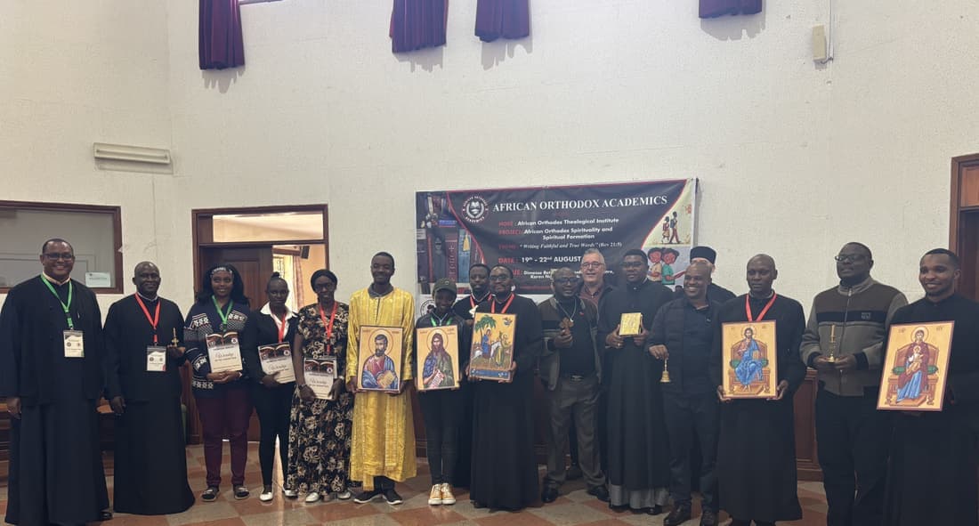 Participants holding icons at the close of the workshop.