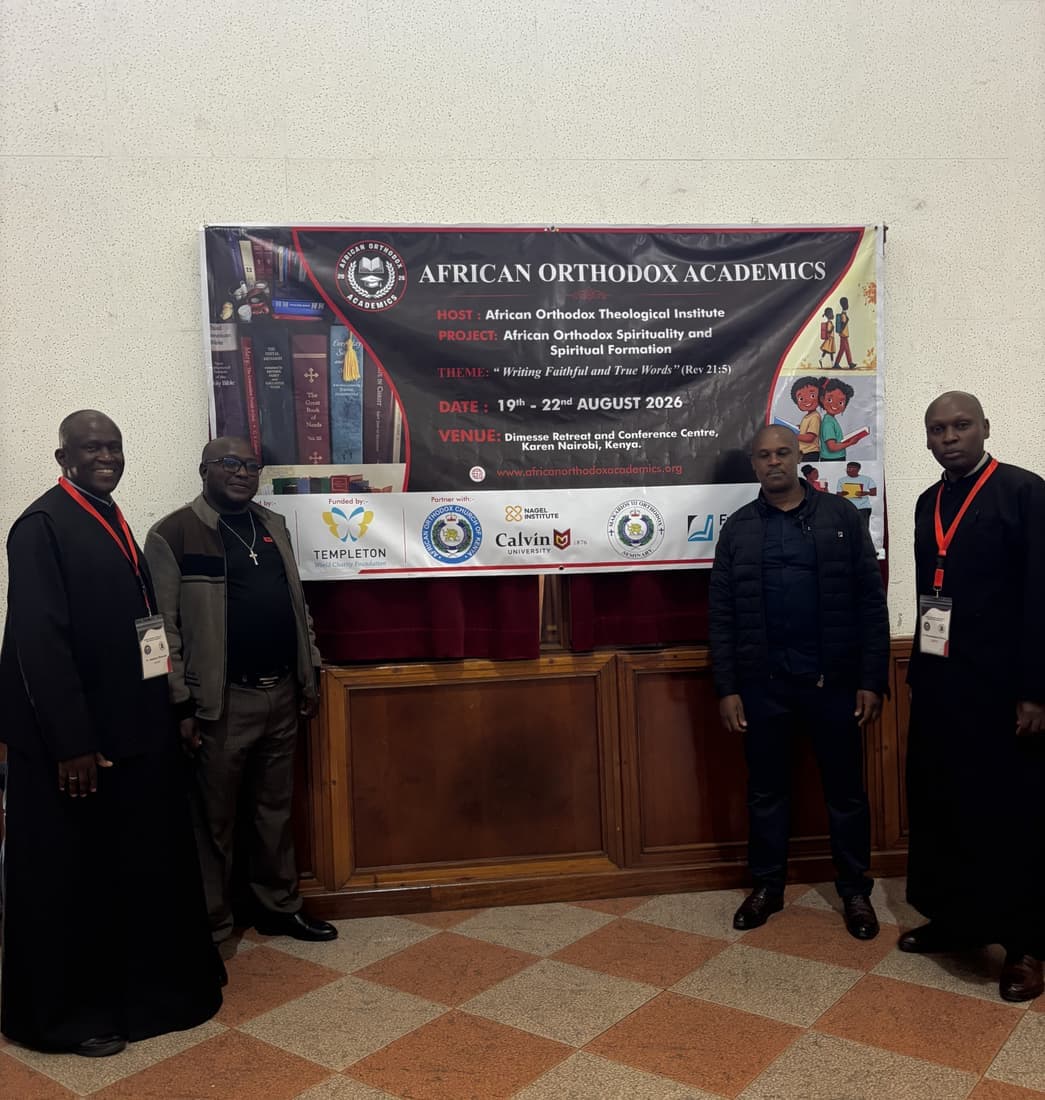 Participants photographed beside the project banner at the close of the workshop.