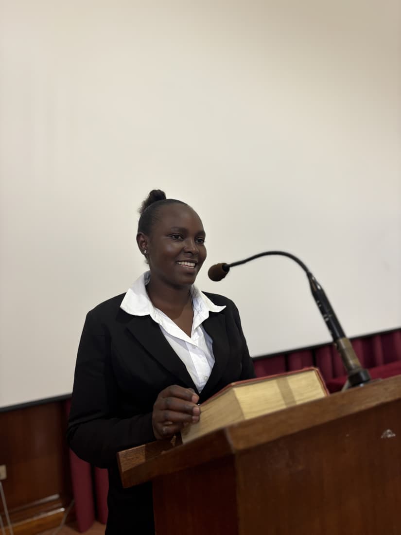 A participant speaking from the lectern on the final day.