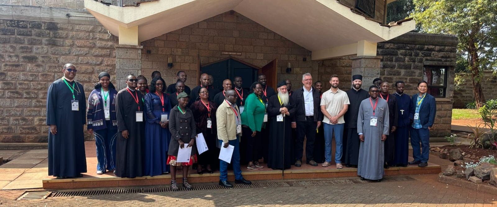 The writers, hierarchs and visiting scholars of the project assembled on the steps outside the conference room at the Dimesse Centre, Karen.